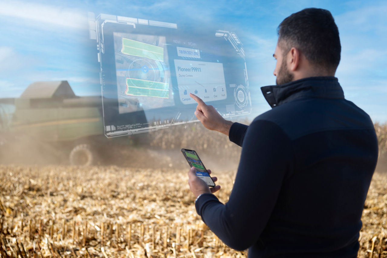man using artificial touchscreen while holding a phone