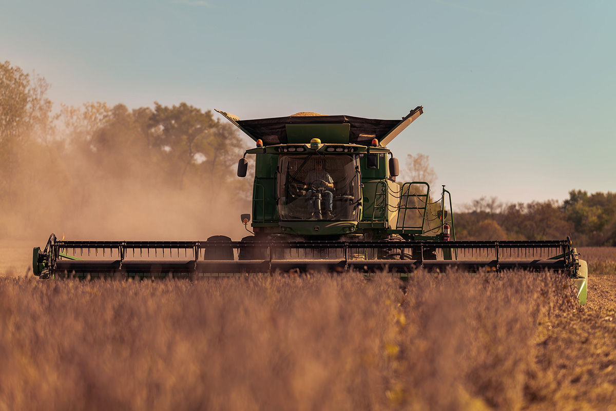 Combine in soybean field