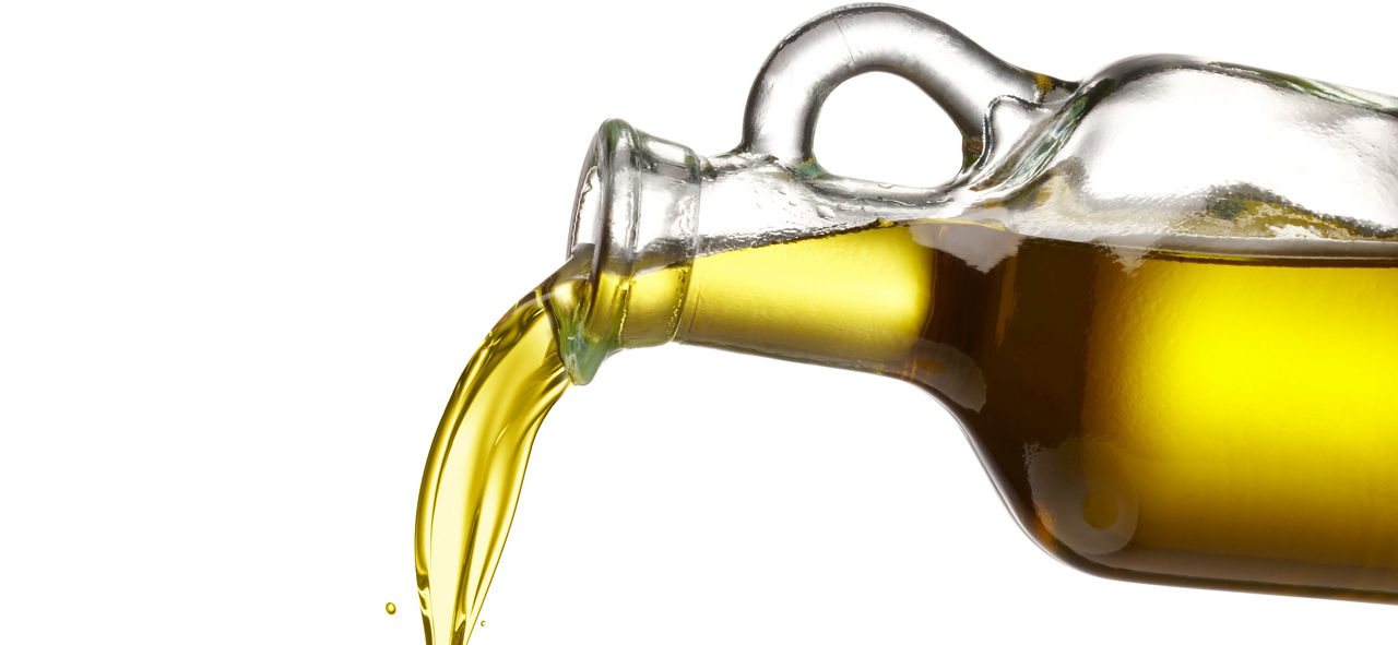 jar of oil spilling