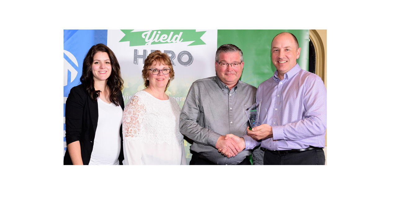 Yield Hero winners being presented with their trophy. 