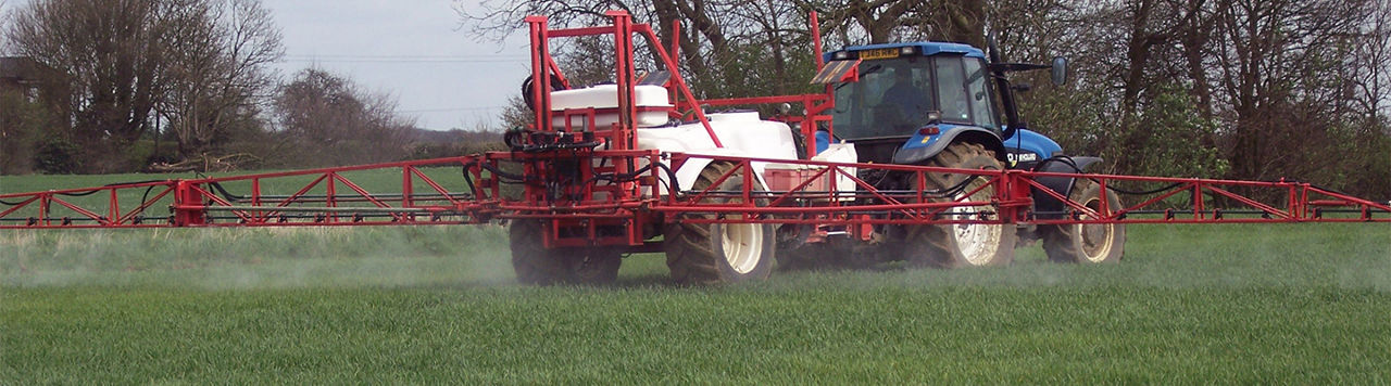 sprayer in wheat field